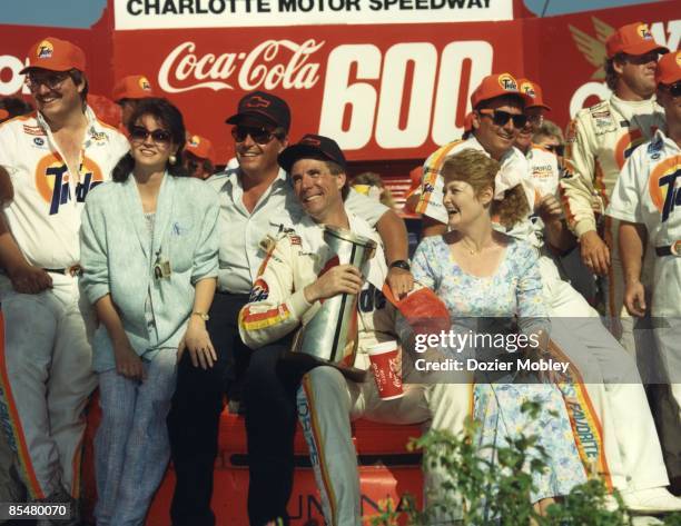 Driver Darrell Waltrip gets a hug from car owner Rick Hendrick in Victory lane after winning the Coca-Cola 600 race on May 29, 1989 at the Charlotte...