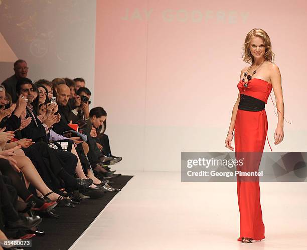 Jennifer Hedger walks the runway wearing a Jay Godfrey design for the The Heart Truth Fashion Show at LG Fashion Week at Nathan Phillips Square on...