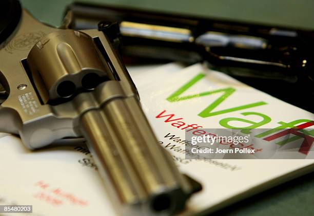 Two guns and a firearms law book are seen in a gun store on March 18, 2009 in Hamburg, Germany. The recent shooting in the German town of Winnenden...