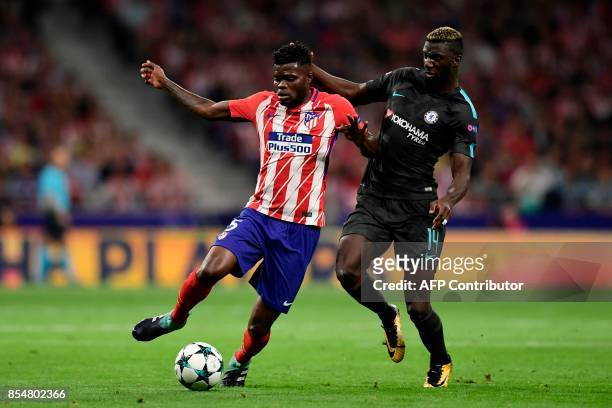 Atletico Madrid's Ghanaian midfielder Thomas vies with Chelsea's French midfielder Tiemoue Bakayoko during the UEFA Champions League Group C football...