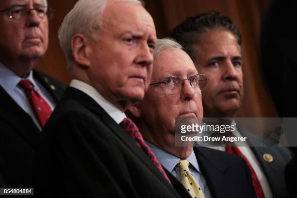 Sen. Mike Enzi , Senate Finance Committee chairman Sen. Orrin Hatch , Senate Majority Leader Mitch McConnell and Rep. Mike Bishop look on during a...