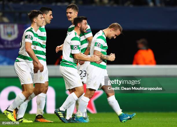 Leigh Griffiths of Celtic celebrates scoring his sides first goal with team mates during the UEFA Champions League group B match between RSC...