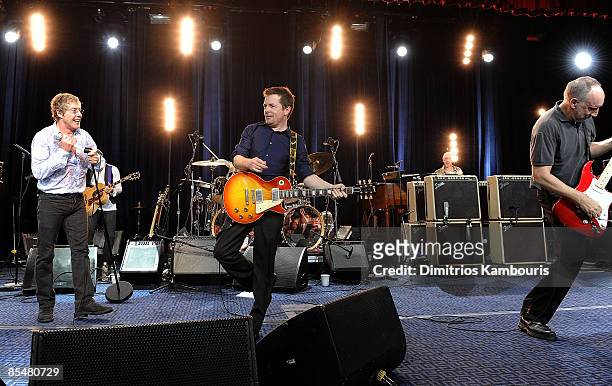 Michael J. Fox performs on stage with Roger Daltrey and Pete Townshend of The Who during "A Funny Thing Happened on the Way to Cure Parkinson's" 2008...