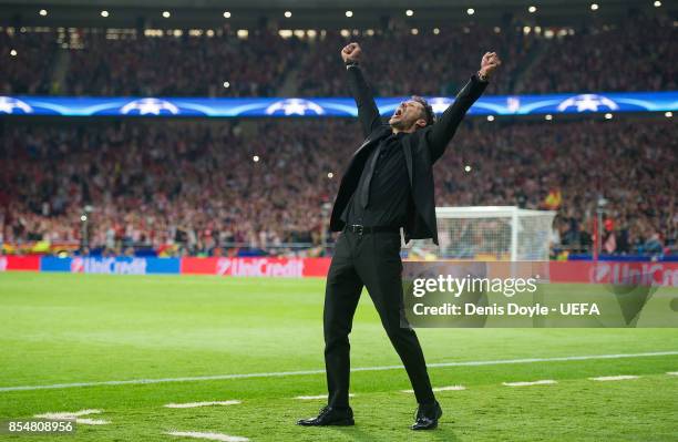 Manager Diego Simeone of Club Atletico de Madrid celebrates after his team scored their opening goal during the UEFA Champions League group C match...