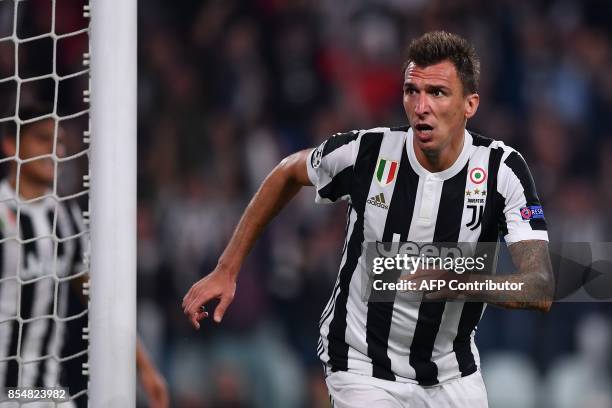 Juventus' forward from Croatia Mario Mandzukic celebrates after scoring during the UEFA Champion's League Group D football match Juventus vs...