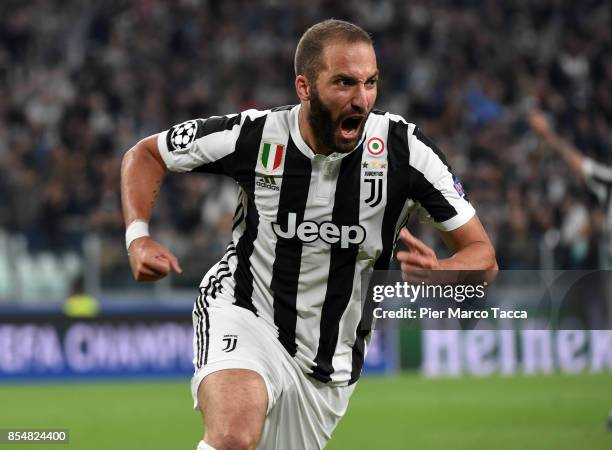 Gonzalo Higuainn of Juventus FC celebrates his first goal during the UEFA Champions League group D match between Juventus and Olympiakos Piraeus at...