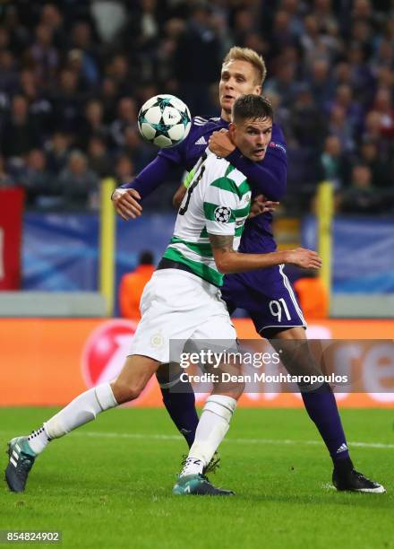 Mikael Lustig of Celtic holds off Lukasz Teodorczyk of RSC Anderlecht during the UEFA Champions League group B match between RSC Anderlecht and...
