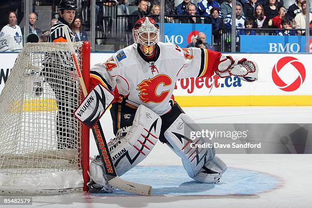 Miikka Kiprusoff of the Calgary Flames defends the net against the Toronto Maple Leafs during the game at Air Canada Centre on March 14, 2009 in...