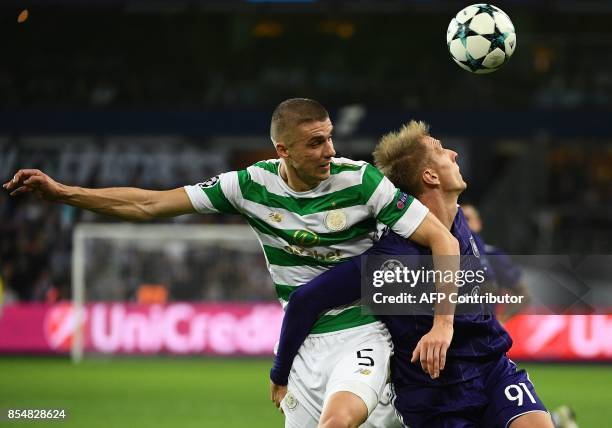 Anderlecht's Lukasz Teodorczyk fights for the ball with Celtic FC's Jozo Simunovic during the UEFA Champions League Group B football match Anderlecht...