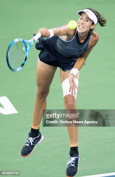 Sept. 27, 2017-- Garbine Muguruza of Spain serves during the singles third round match against Magda Linette of Poland at 2017 WTA Wuhan Open in...