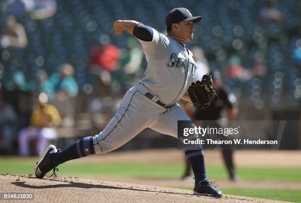 Erasmo Ramirez of the Seattle Mariners pitches against the Oakland Athletics in the bottom of the first inning at Oakland Alameda Coliseum on...