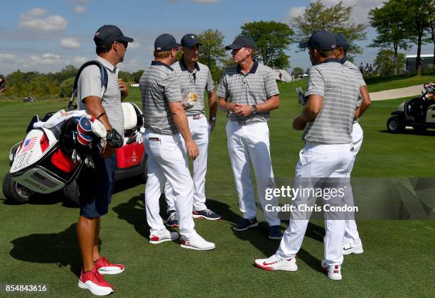 Jim Furyk, Captains Assistant of the U.S. Team, and Steve Stricker, Captain of the U.S. Team, talk to players during a practice round prior to the...