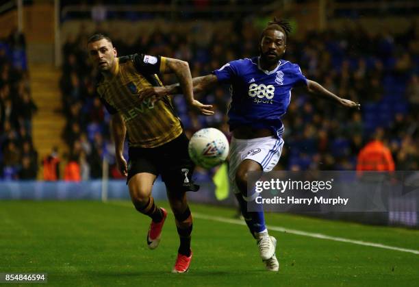 Jack Hunt of Sheffield Wednesday and Jacques Maghoma of Birmingham City battle for possession during the Sky Bet Championship match between...