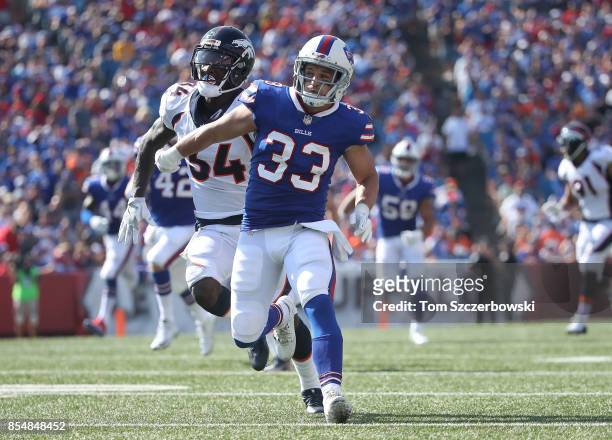 Colt Anderson of the Buffalo Bills hussles down the field as the Bills punt the ball during NFL game action against the Denver Broncos at New Era...