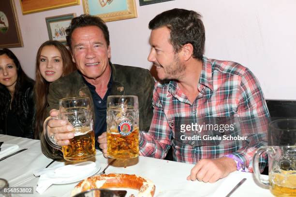Stella Glaubitz, granddaughter of Guenter Heinlein, Arnold Schwarzenegger and Rene Benko during the Oktoberfest at Kaeferzelt at Theresienwiese on...