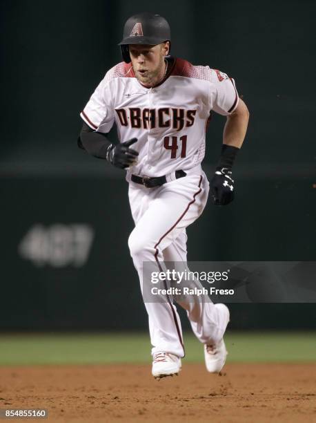 Jeremy Hazelbaker of the Arizona Diamondbacks runs to third base on a triple against the San Francisco Giants during the second inning of a MLB game...