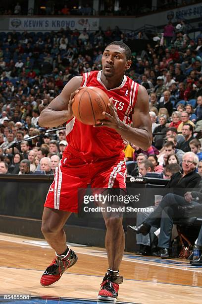 Ron Artest of the Houston Rockets passes the ball during the game against the Minnesota Timberwolves on March 1, 2009 at the Target Center in...