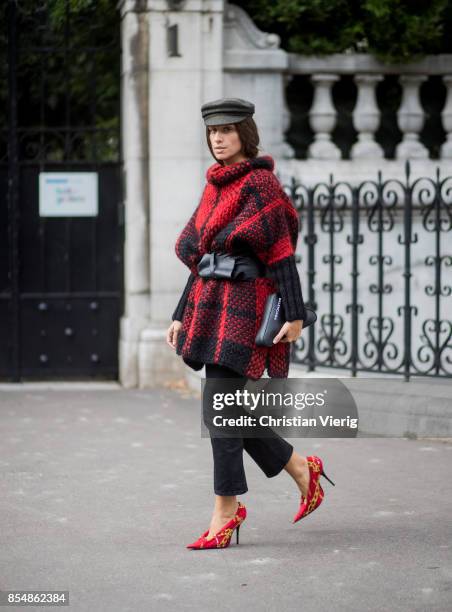 Erika Boldrin wearing flat cap, checked jacket, belt, cropped denim jeans, heels is seen outside Dries van Noten during Paris Fashion Week...