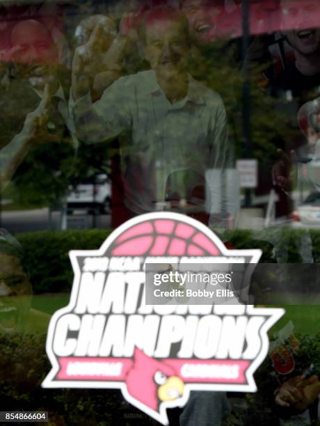 Mural of Rick Pitino and the 2013 NCAA Men's National Championship basketball team can be seen through the window of the Yum! Center Practice...