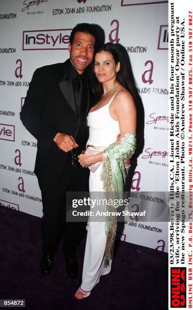 Beverly Hills, CA. Lionel Richie and his four month pregnant wife, Diane Alexander arriving for the ''Elton John Aids Foundation'' Oscar party, at...