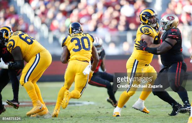 Jamon Brown and John Sullivan of the Los Angeles Rams create a hole for Todd Gurley during the game against the San Francisco 49ers at Levi's Stadium...