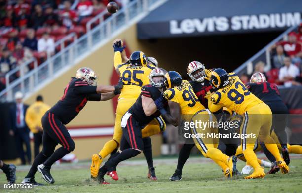 Brandon Fusco, Daniel Kilgore and Laken Tomlinson of the San Francisco 49ers block during the game against the Los Angeles Rams at Levi's Stadium on...