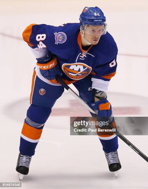 Mikhail Grabovski of the New York Islanders plays in a game against the New Jersey Devils at Nassau Veterans Memorial Coliseum on December 15, 2014...