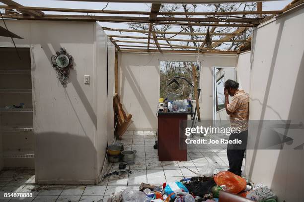 Ramon Torres stands in what is left of his sister-in-law's home that was destroyed when Hurricane Maria passed through on September 27, 2017 in...