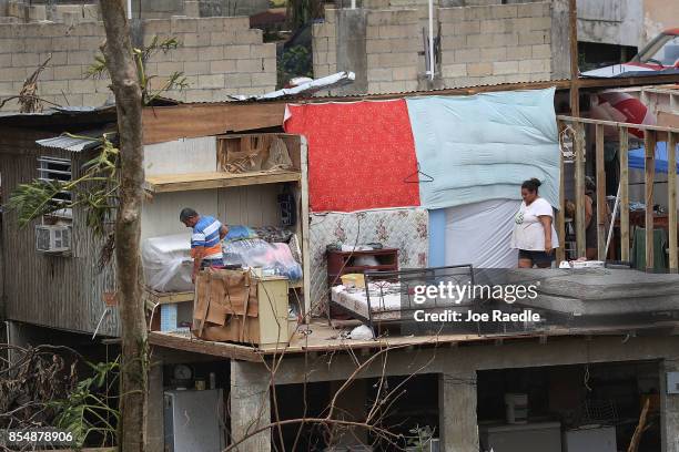 Jose Bernard and his daughter Yolymar Bernard salvage what they can from their home that was destroyed when Hurricane Maria passed through on...