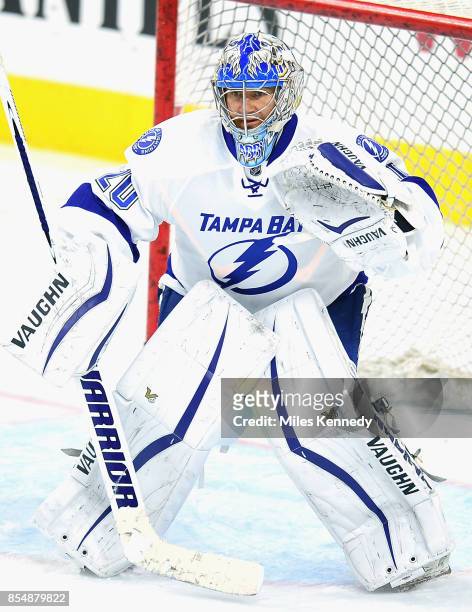 Goaltender Evgeni Nabokov of the Tampa Bay Lightning warms up prior to the NHL game against the Philadelphia Flyers at Wells Fargo Center on December...