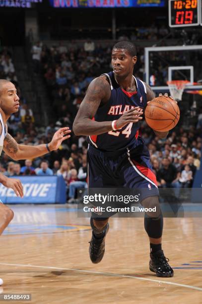 Marvin Williams of the Atlanta Hawks drives against Dahntay Jones of the Denver Nuggets during the game on February 25, 2009 at the Pepsi Center in...