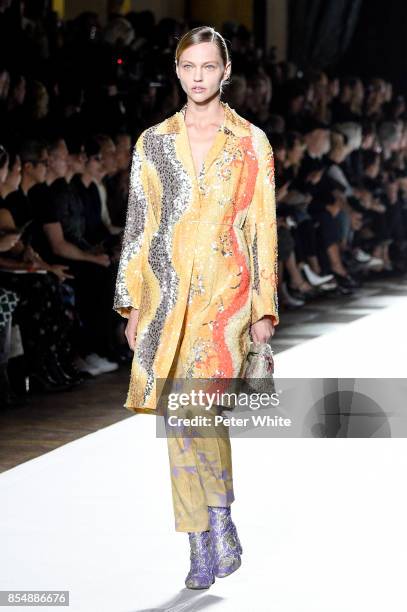 Sasha Pivovarova walks the runway during the Dries Van Noten show as part of the Paris Fashion Week Womenswear Spring/Summer 2018 on September 27,...