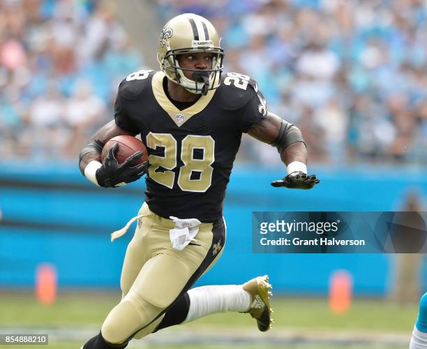 Adrian Peterson of the New Orleans Saints runs against the Carolina Panthers during their game at Bank of America Stadium on September 24, 2017 in...