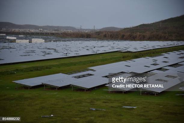 Damaged solar panel plant is seen in Humacao, eastern Puerto Rico, on September 27 one week after the passage of Hurricane Maria. - The US island...