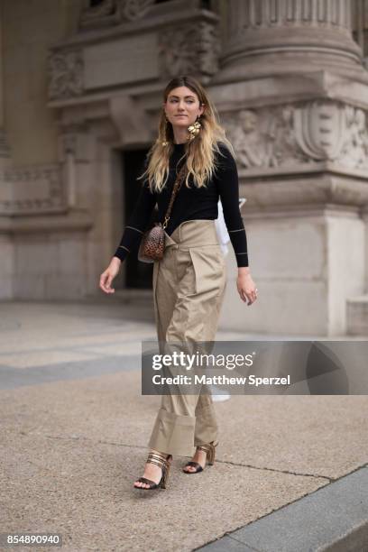 Megan Reynolds is seen attending Maison Margiela during Paris Fashion Week wearing Preen, Ferragamo, Simon Rocha, Balenciaga on September 27, 2017 in...
