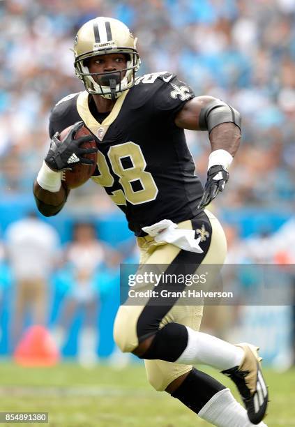 Adrian Peterson of the New Orleans Saints runs against the Carolina Panthers during their game at Bank of America Stadium on September 24, 2017 in...