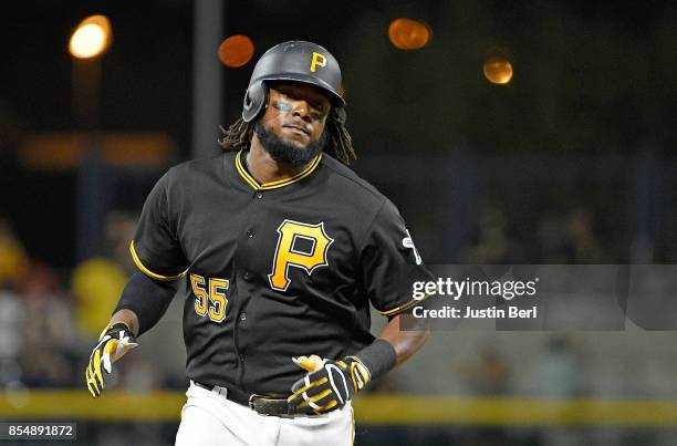 Josh Bell of the Pittsburgh Pirates rounds the bases after hitting a two run home run in the third inning during the game against the Baltimore...