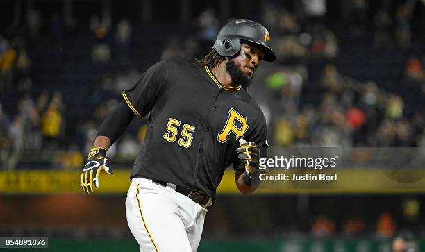 Josh Bell of the Pittsburgh Pirates rounds the bases after hitting a two run home run in the third inning during the game against the Baltimore...