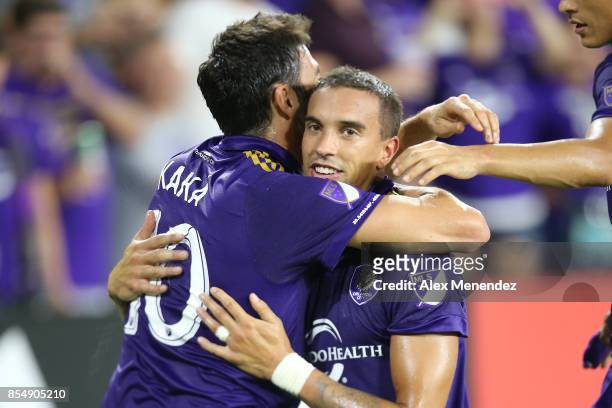 Kaka of Orlando City SC hugs Sebastian Hines after Hines scored a goal during a MLS soccer match against the New England Revolution at Orlando City...