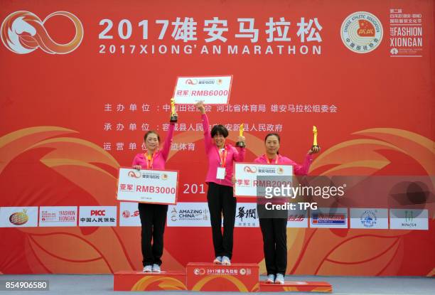 The 2017 Xiongan Marathon kicks off at the front square of Baiyangdian Railway Station, Rongcheng County, north Chinas Hebei Province, Sept. 24,...