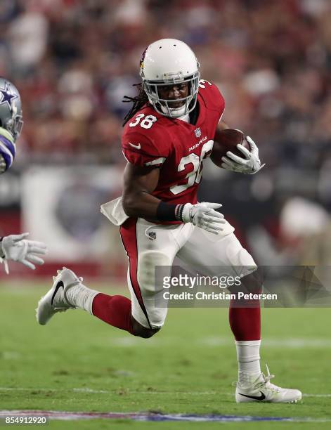Running back Andre Ellington of the Arizona Cardinals rushes the football against the Dallas Cowboys during the NFL game at the University of Phoenix...