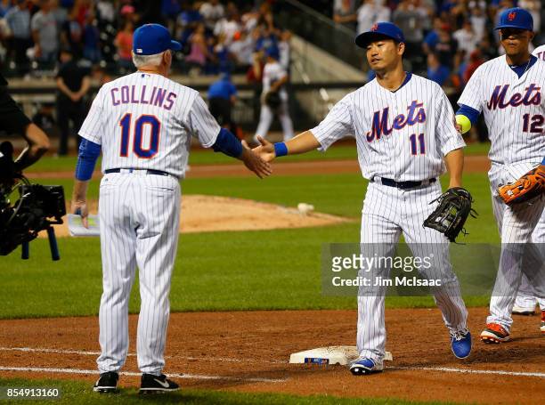 Norichika Aoki of the New York Mets celebrates with manager Terry Collins after defeating the Atlanta Braves at Citi Field on September 27, 2017 in...
