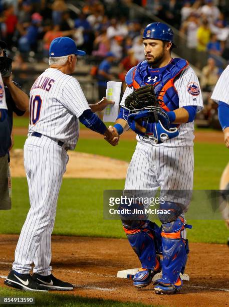 Travis d'Arnaud of the New York Mets celebrates with manager Terry Collins after defeating the Atlanta Braves at Citi Field on September 27, 2017 in...