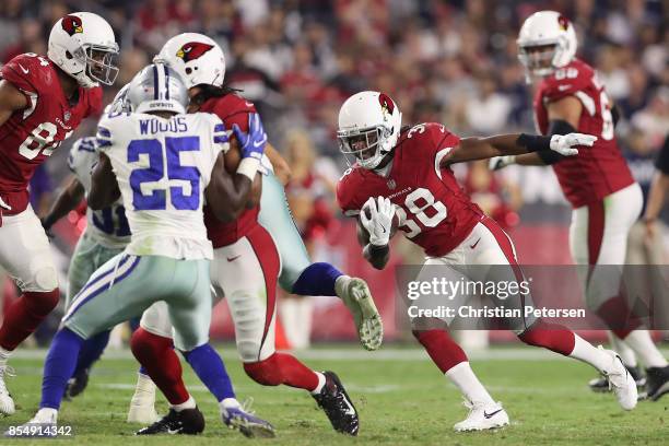 Running back Andre Ellington of the Arizona Cardinals rushes the football against the Dallas Cowboys during the NFL game at the University of Phoenix...