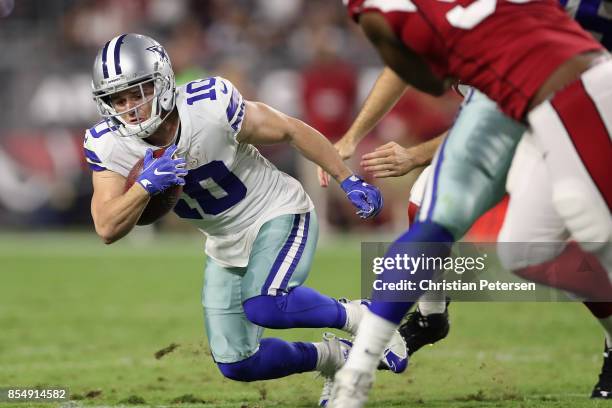 Wide receiver Ryan Switzer of the Dallas Cowboys returns a punt during the fourth quarter of the NFL game against the Arizona Cardinals at the...