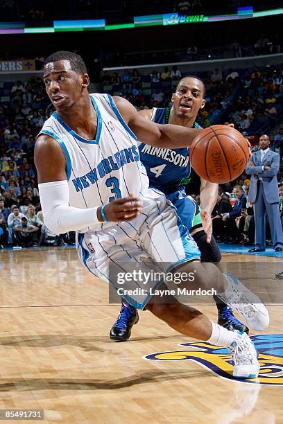 Chris Paul of the New Orleans Hornets drives past Randy Foye of the Minnesota Timberwolves on March 18, 2009 at the New Orleans Arena in New Orleans,...