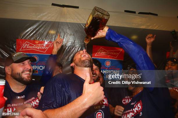 John Lackey of the Chicago Cubs celebrates after winning the National League Central title against the St. Louis Cardinals at Busch Stadium on...