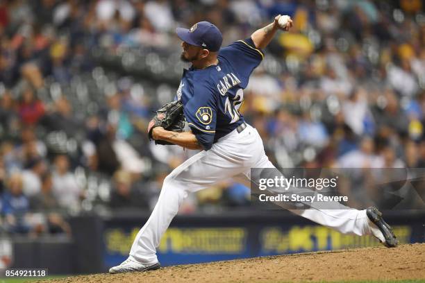 Matt Garza of the Milwaukee Brewers throws a pitch during the eighth inning of a game against the Cincinnati Reds at Miller Park on September 27,...