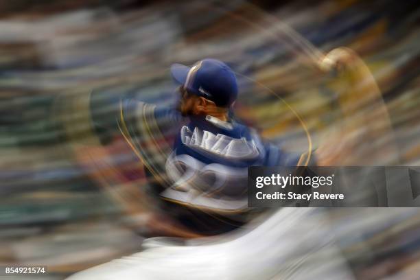 Matt Garza of the Milwaukee Brewers throws a pitch during the eighth inning of a game against the Cincinnati Reds at Miller Park on September 27,...