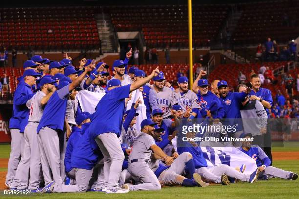 Members of the Chicago Cubs pose for a photograph after winning the National League Central title against the St. Louis Cardinals at Busch Stadium on...